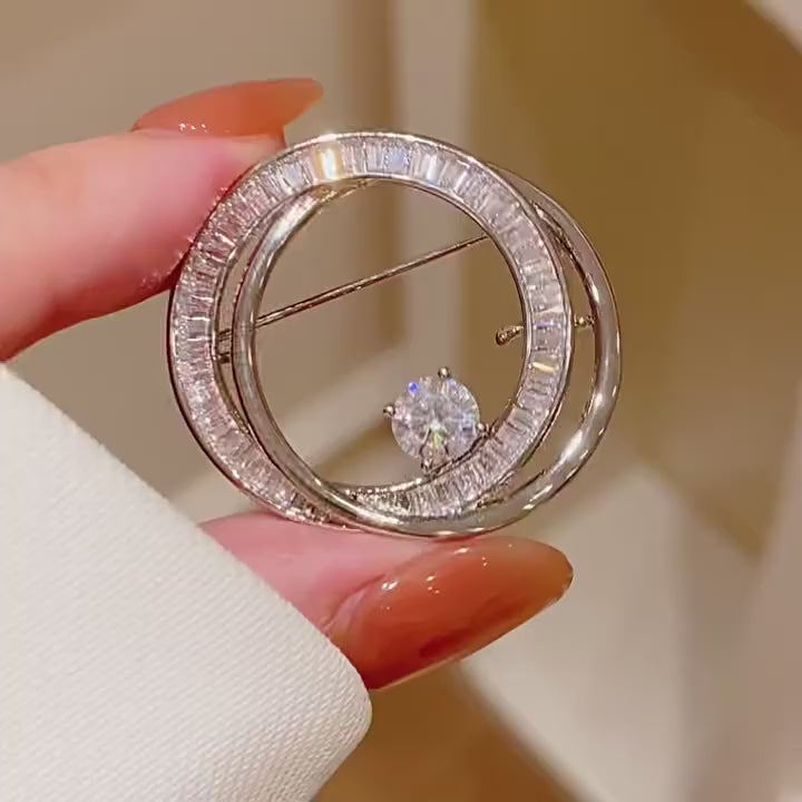 Oona Baguette Zircon Double-Loop Brooch in a silent product film. 