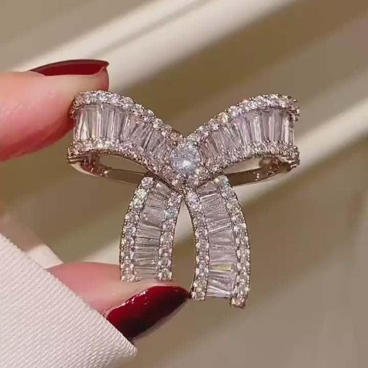Salla Baguette Zircon Bow Brooch shown from several angles in a silent product film.