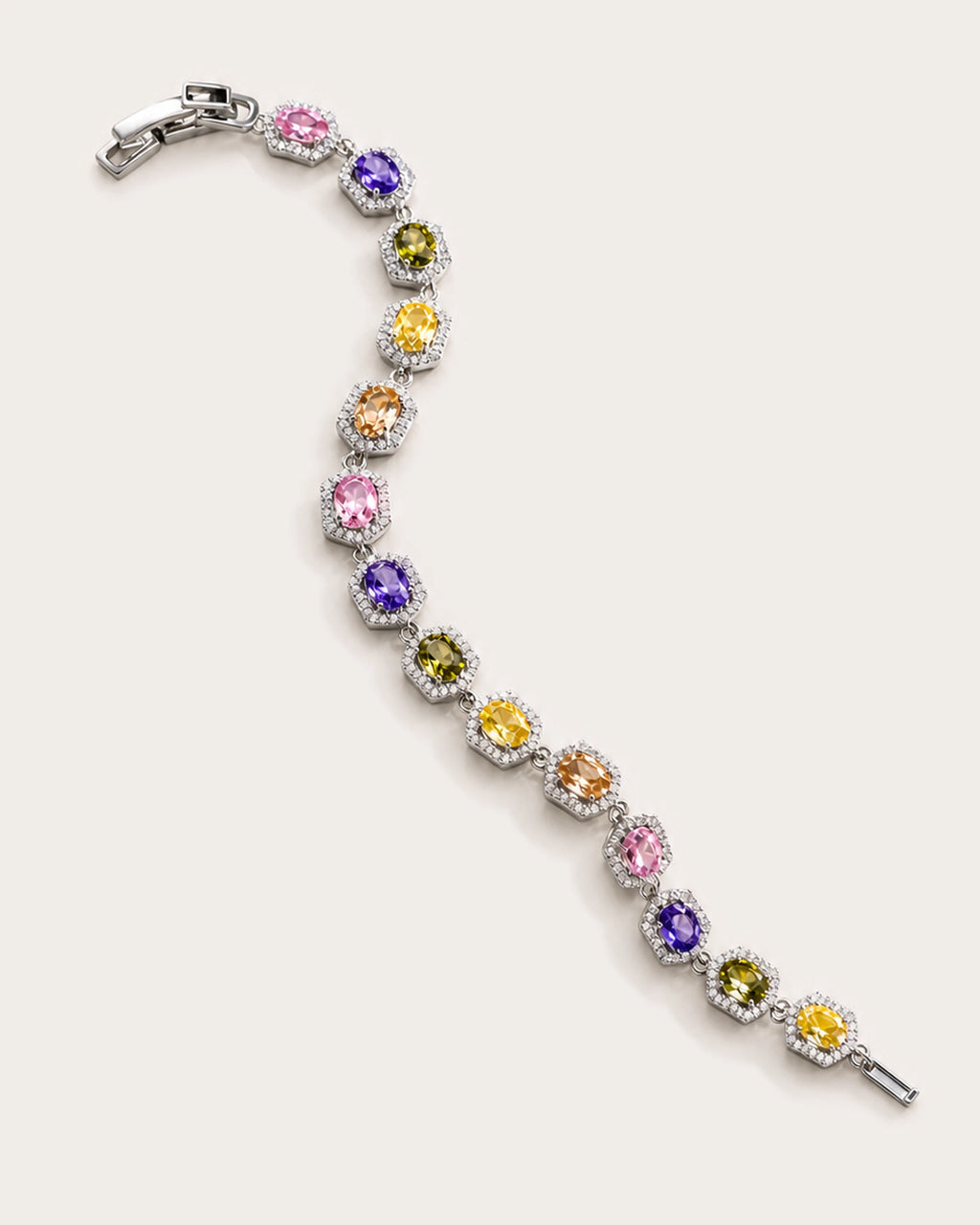 Prisma Multicolor Zircon Link Bracelet arranged on a warm #F0EBE9 studio background with natural contact shadow.