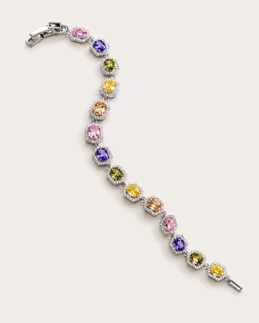 Prisma Multicolor Zircon Link Bracelet arranged on a warm #F0EBE9 studio background with natural contact shadow.