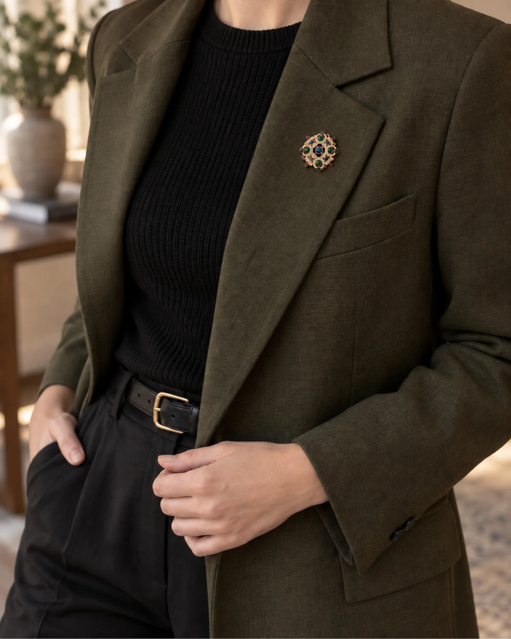 Ragna Multicolor Ornate Medallion Brooch — model wearing the brooch with a tailored outfit, wider view