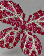Close detail of Raisa synthetic red corundum stones, clear veins and silver-tone prongs