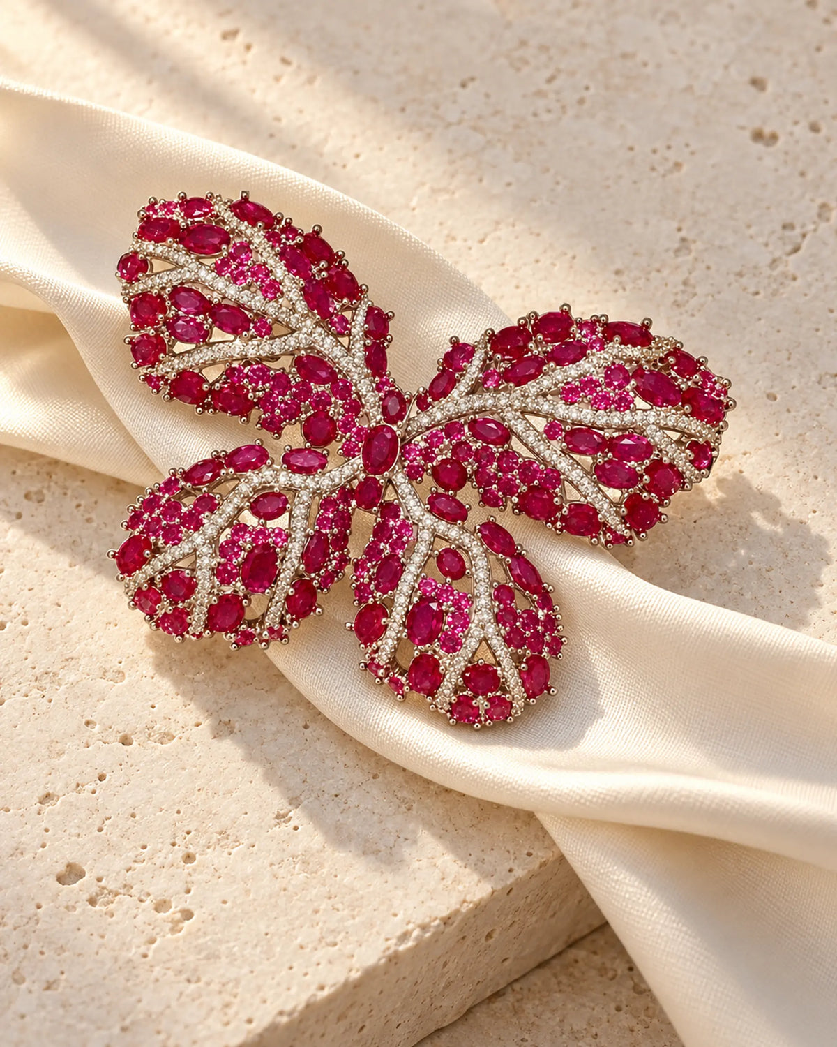 Raisa butterfly brooch on pale stone with an ivory silk ribbon