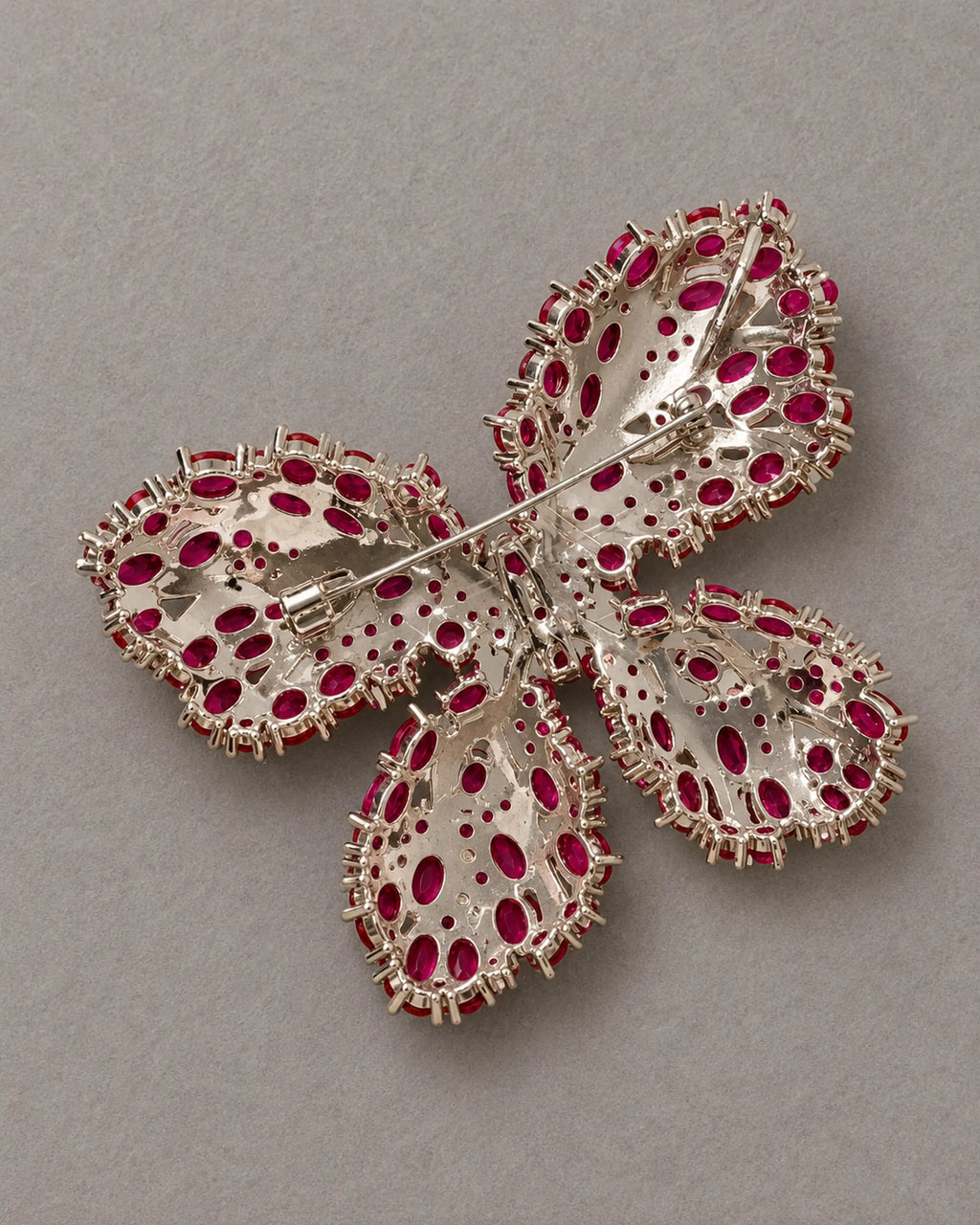Reverse of Raisa butterfly brooch showing the actual hinged pin and open stone settings