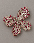 Reverse of Raisa butterfly brooch showing the actual hinged pin and open stone settings