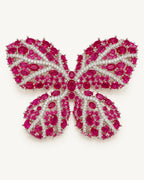 Raisa red synthetic corundum butterfly brooch with clear stone veins in a silver-tone copper setting
