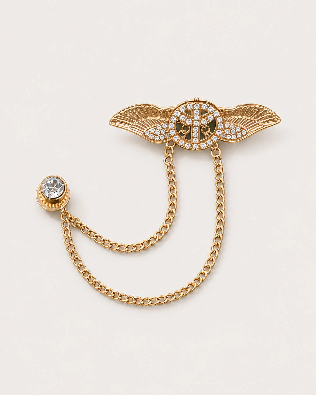 Rauha winged circular motif chain brooch in gold-tone finish, with two draped chains and a round stud