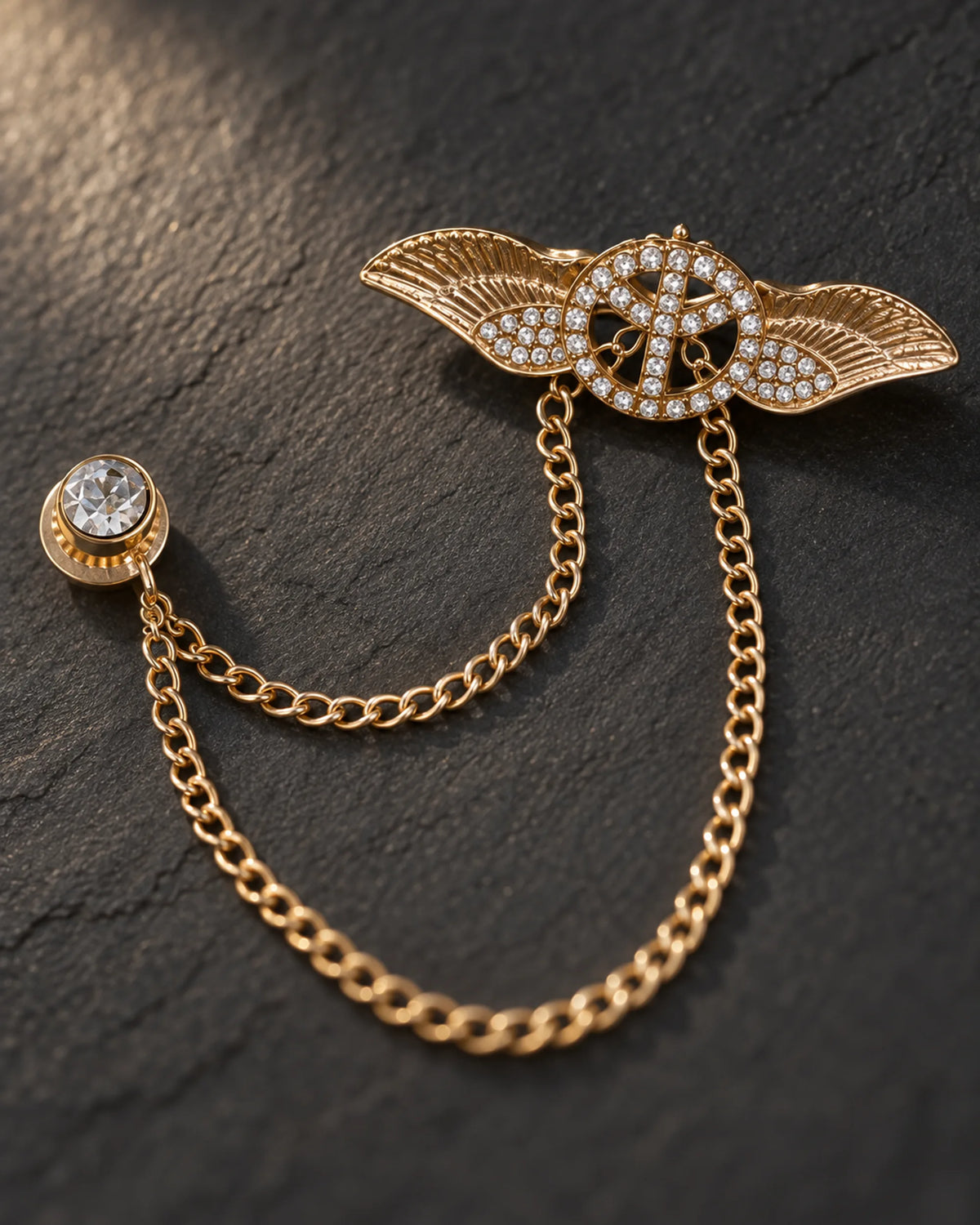 Rauha Winged Circle Lapel Chain Brooch in gold-tone finish — detail study of the motif and chains