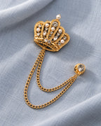 Regna Crown Lapel Chain Brooch in gold-tone finish; still-life view showing the full drape