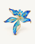 Riina Enamel Petal Flower Brooch in Blue, showing five pointed enamel petals, gold-tone borders and blue zircon accents.