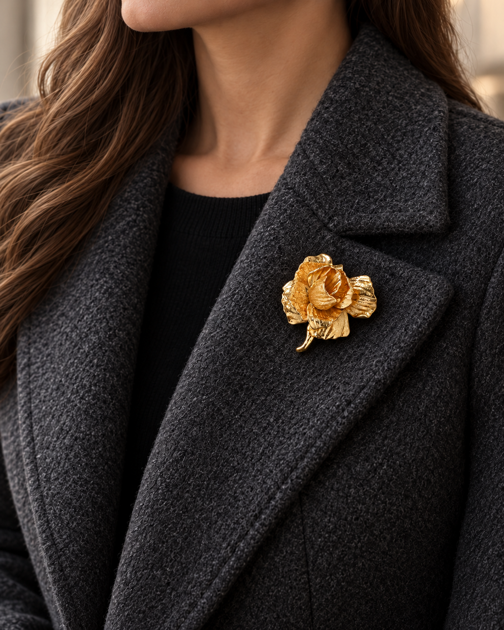 Rosana Sculpted Rose Brooch worn on a charcoal wool lapel