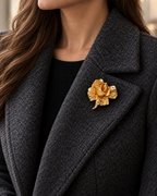 Rosana Sculpted Rose Brooch worn on a charcoal wool lapel