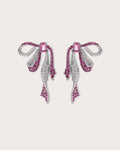 Runa Ribbon Bow Drop Earrings in White & Fuchsia on a soft blush background