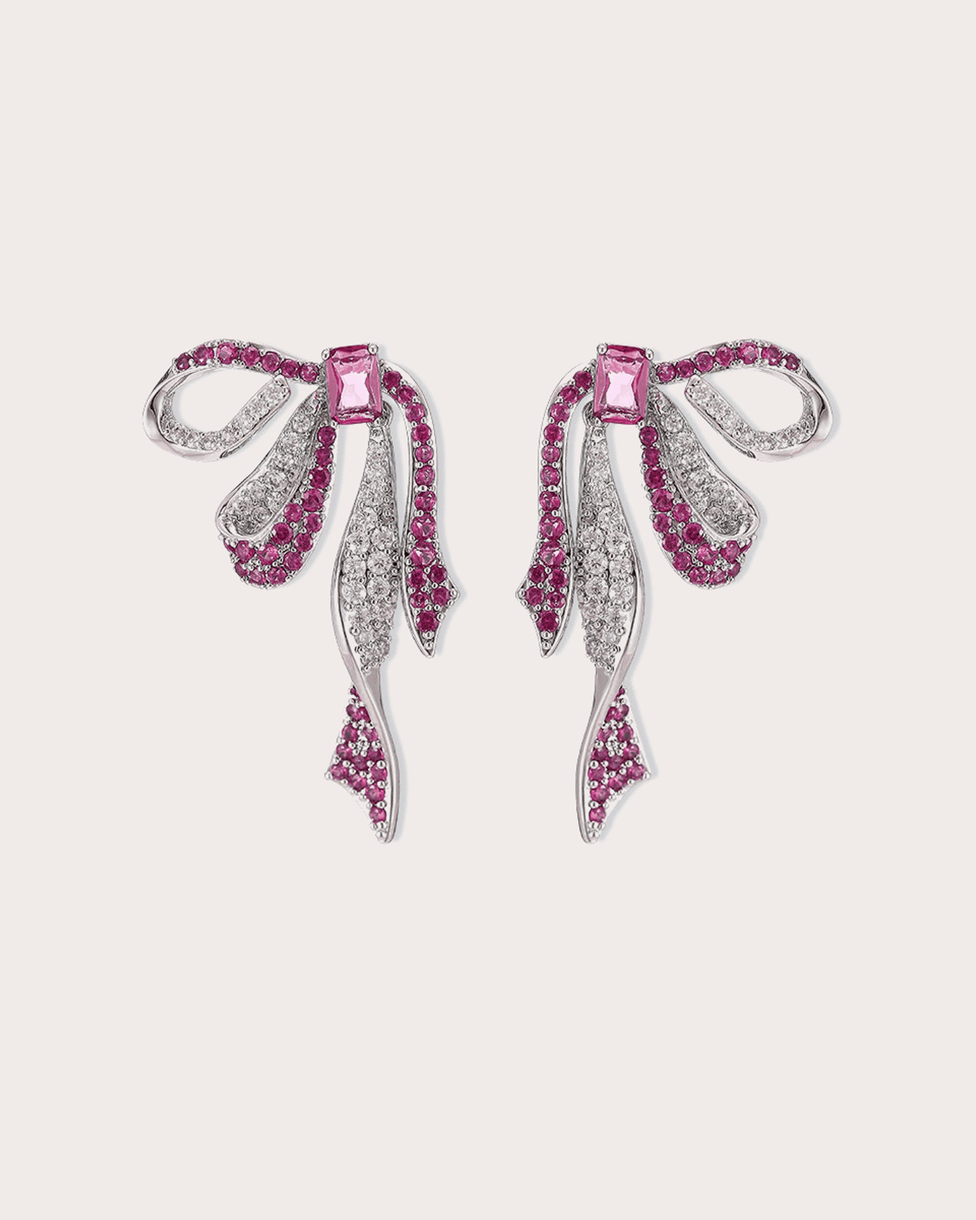 Runa Ribbon Bow Drop Earrings in White & Fuchsia on a soft blush background