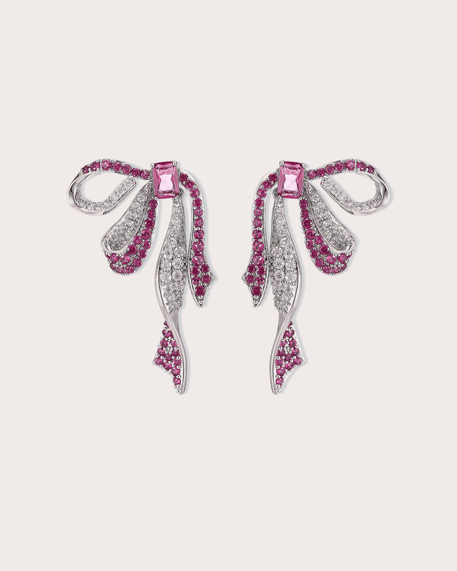 Runa Ribbon Bow Drop Earrings in White & Fuchsia on a soft blush background