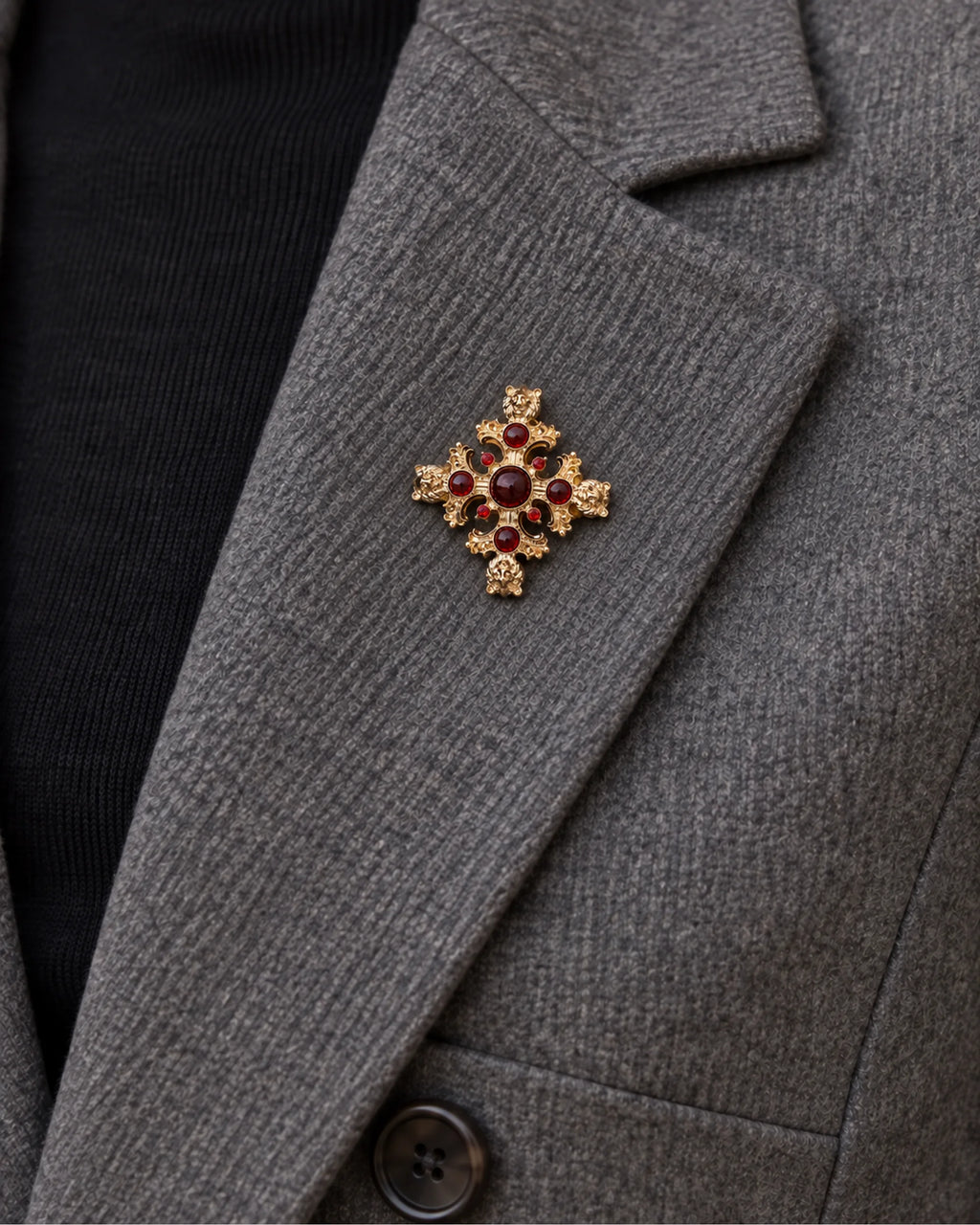 Rurik Red Lion Cross Brooch — model wearing the brooch on a jacket lapel, close view
