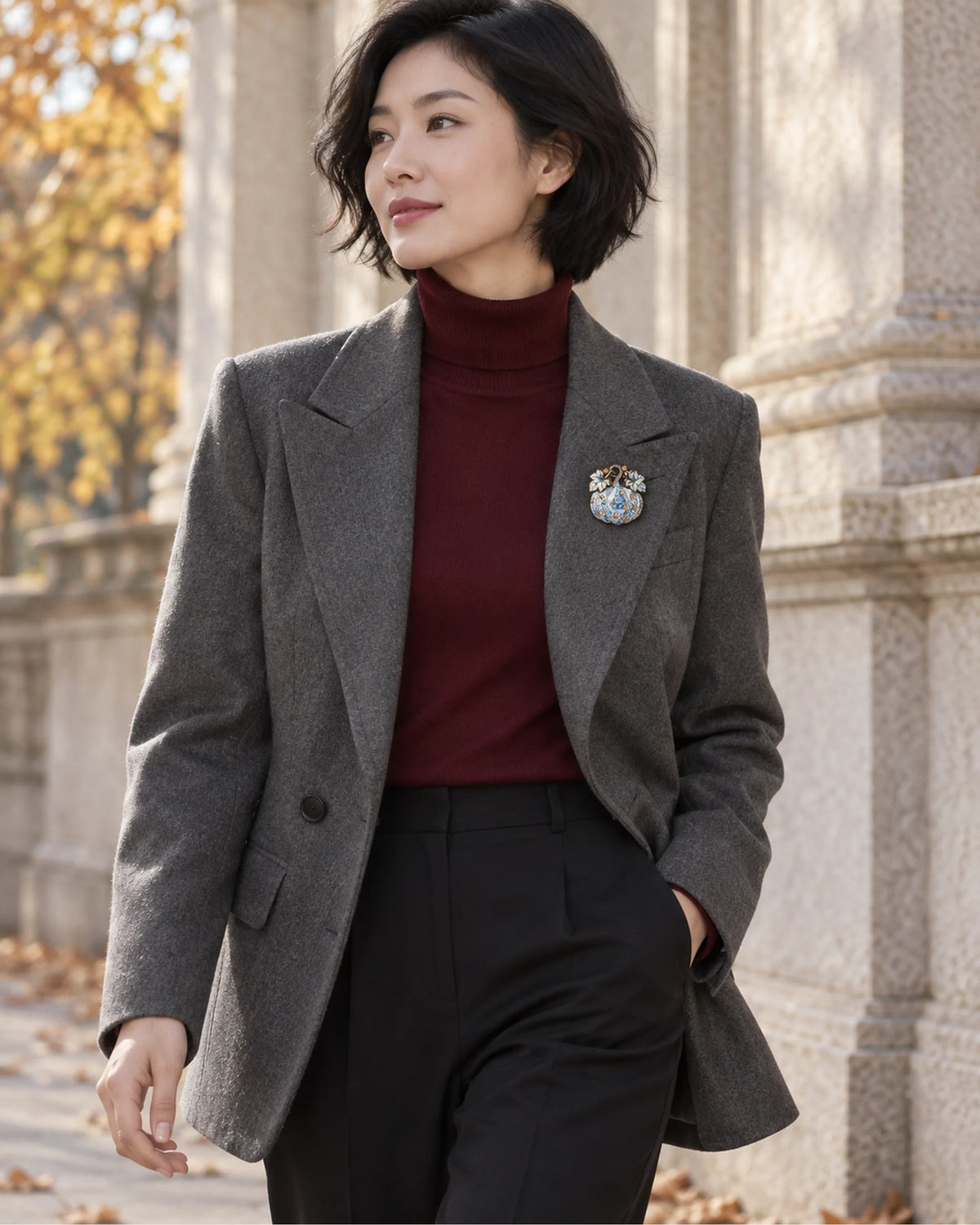 A small Blue & White pumpkin adds a cool accent to gray tailoring and a burgundy knit.