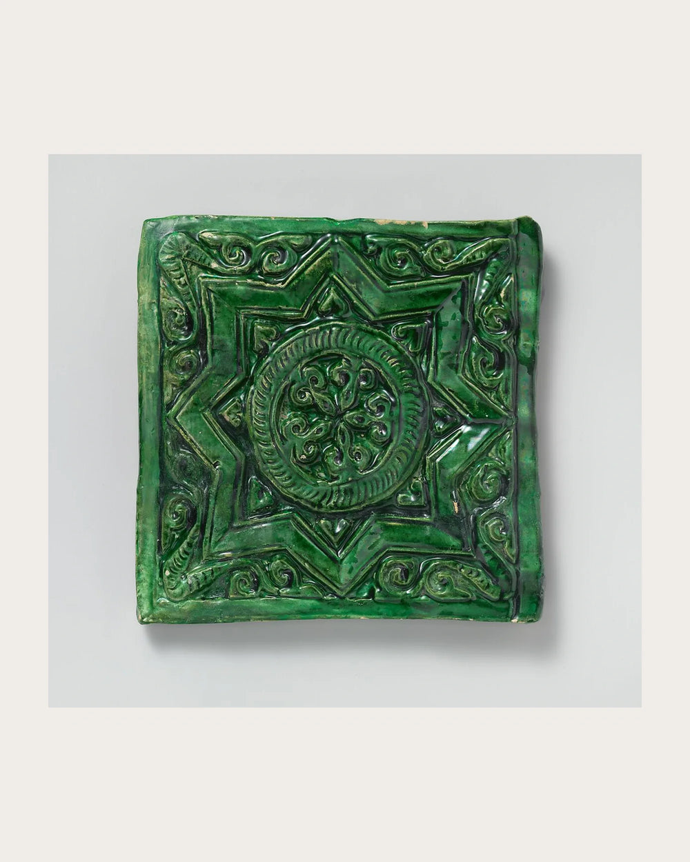 A Green Tile in Layered Relief