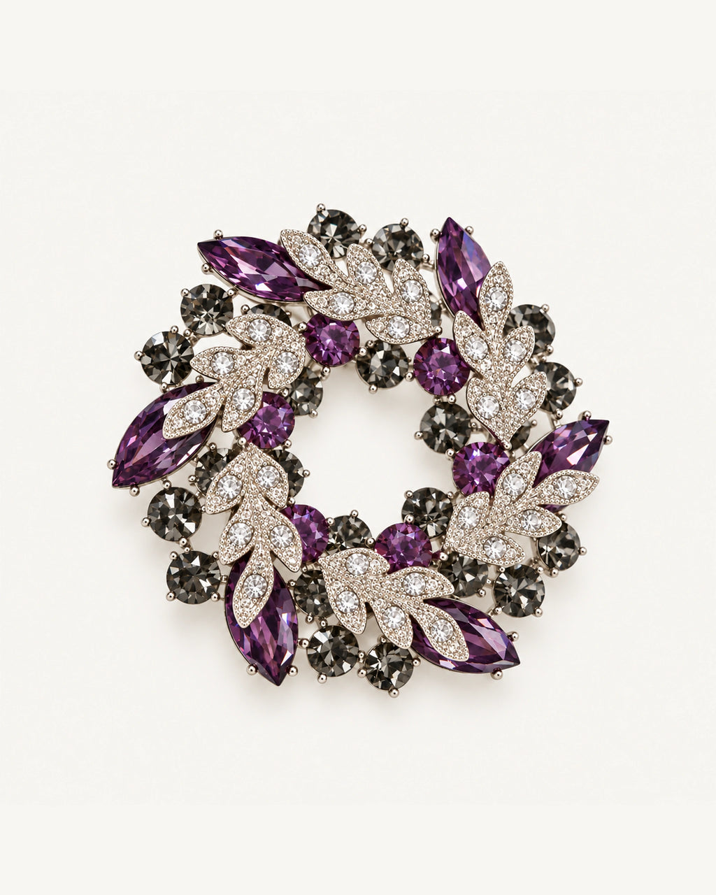 Purple crystal leaf wreath brooch with clear pavé leaves and smoky-grey stones in a silver-tone setting