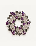 Purple crystal leaf wreath brooch with clear pavé leaves and smoky-grey stones in a silver-tone setting