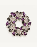 Purple crystal leaf wreath brooch with clear pavé leaves and smoky-grey stones in a silver-tone setting