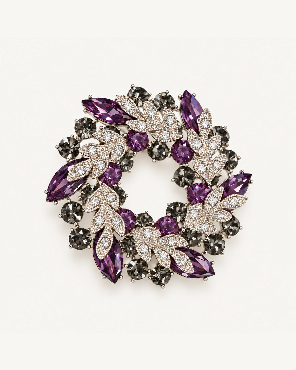 Purple crystal leaf wreath brooch with clear pavé leaves and smoky-grey stones in a silver-tone setting