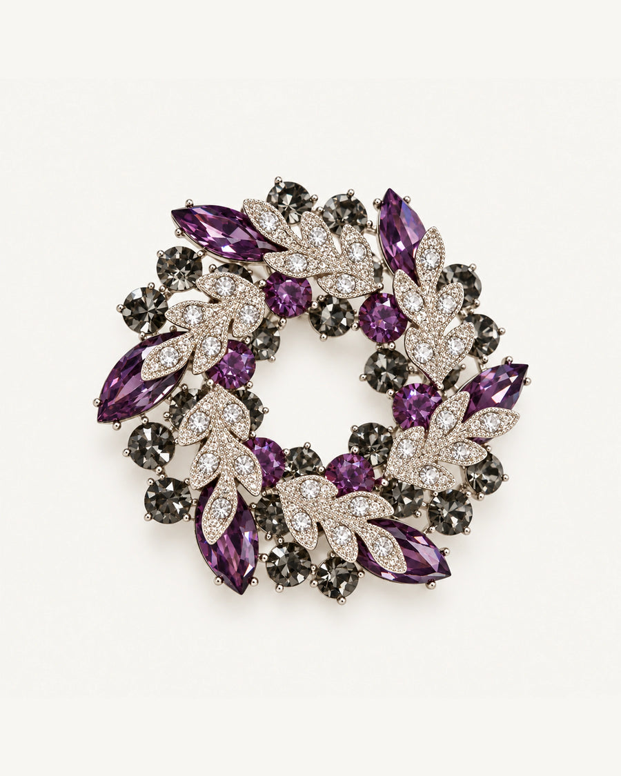 Purple crystal leaf wreath brooch with clear pavé leaves and smoky-grey stones in a silver-tone setting