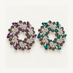 Purple and Green crystal leaf wreath brooches shown side by side at the same scale