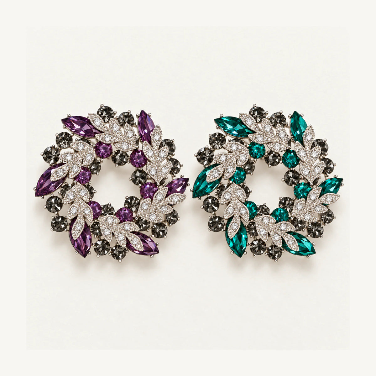 Purple and Green crystal leaf wreath brooches shown side by side at the same scale