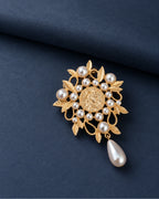 Signe Coin Medallion Drop Brooch — front display on folded slate-blue paper