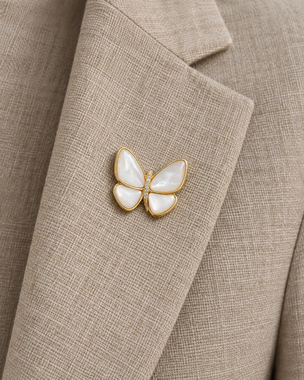 Siipi Shell Butterfly Magnetic Brooch, Gold & White worn on a linen jacket lapel, close view
