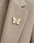 Siipi Shell Butterfly Magnetic Brooch, Gold & White worn on a linen jacket lapel, close view