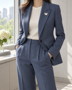 Siipi Shell Butterfly Magnetic Brooch, Gold & White worn with a blue jacket, wider styling view