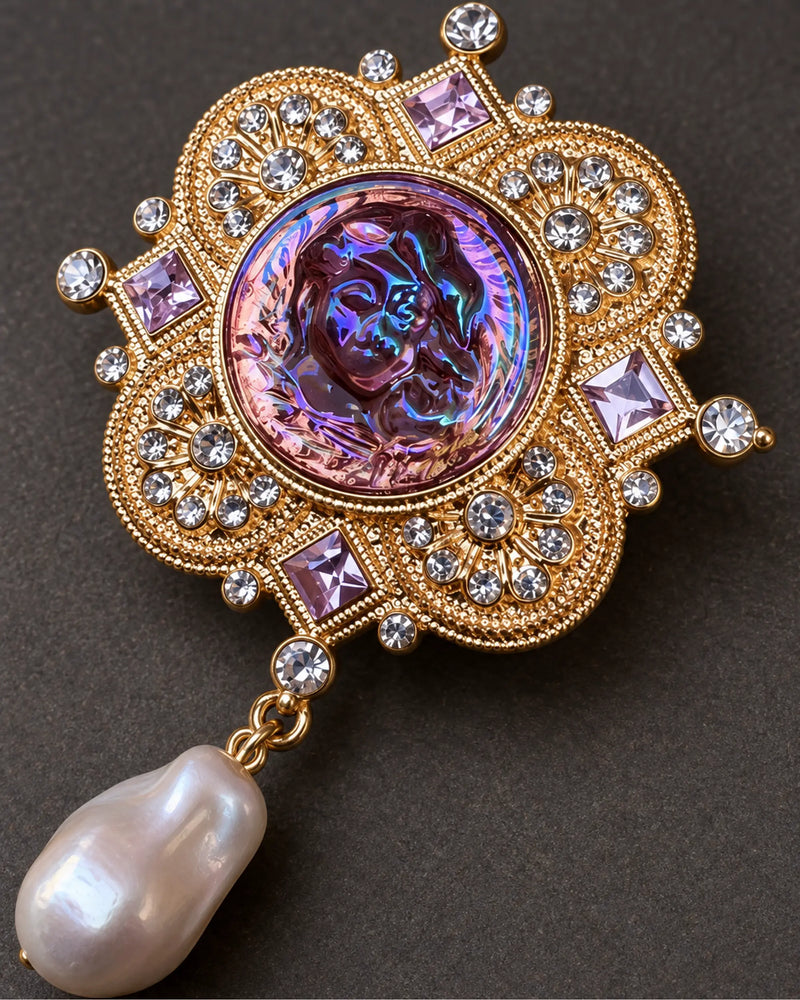 Siv Purple Face Medallion Brooch — raised ornament and surface details, macro view