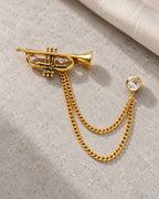 Sointu Trumpet Lapel Chain Brooch in gold-tone finish; complete still-life drape