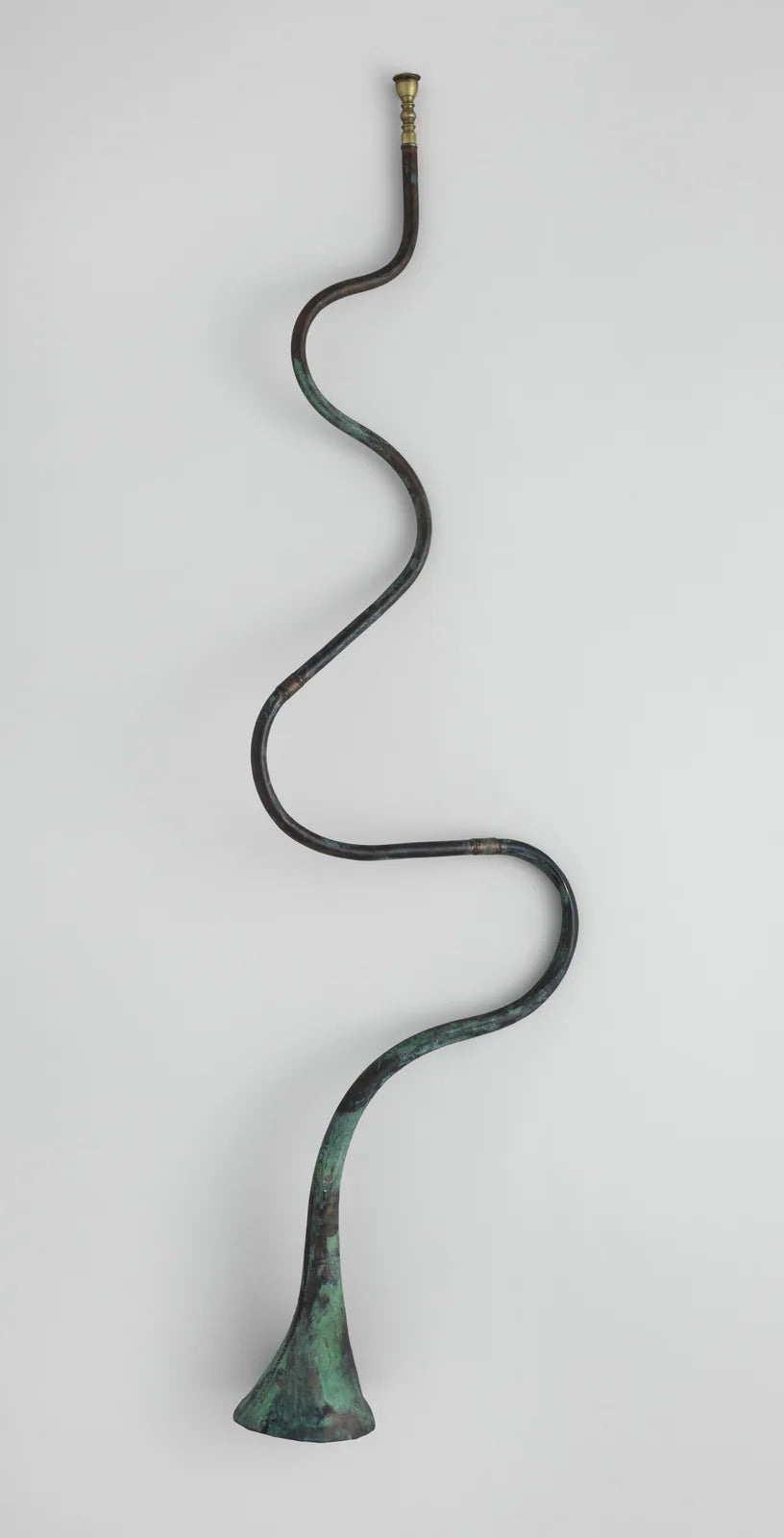 A tube, a curve, a flared bell