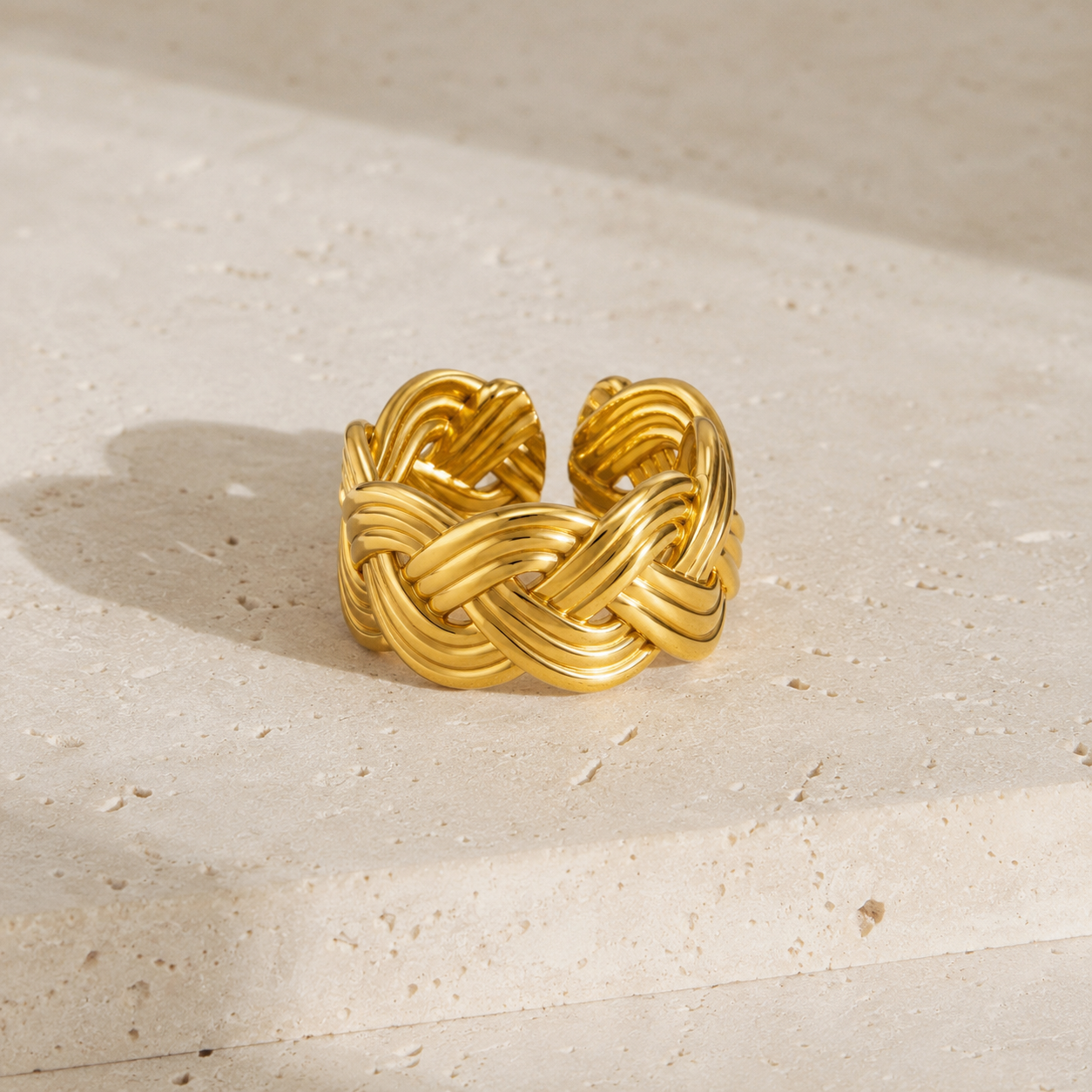 Sola Knot Band Ring product display on stone