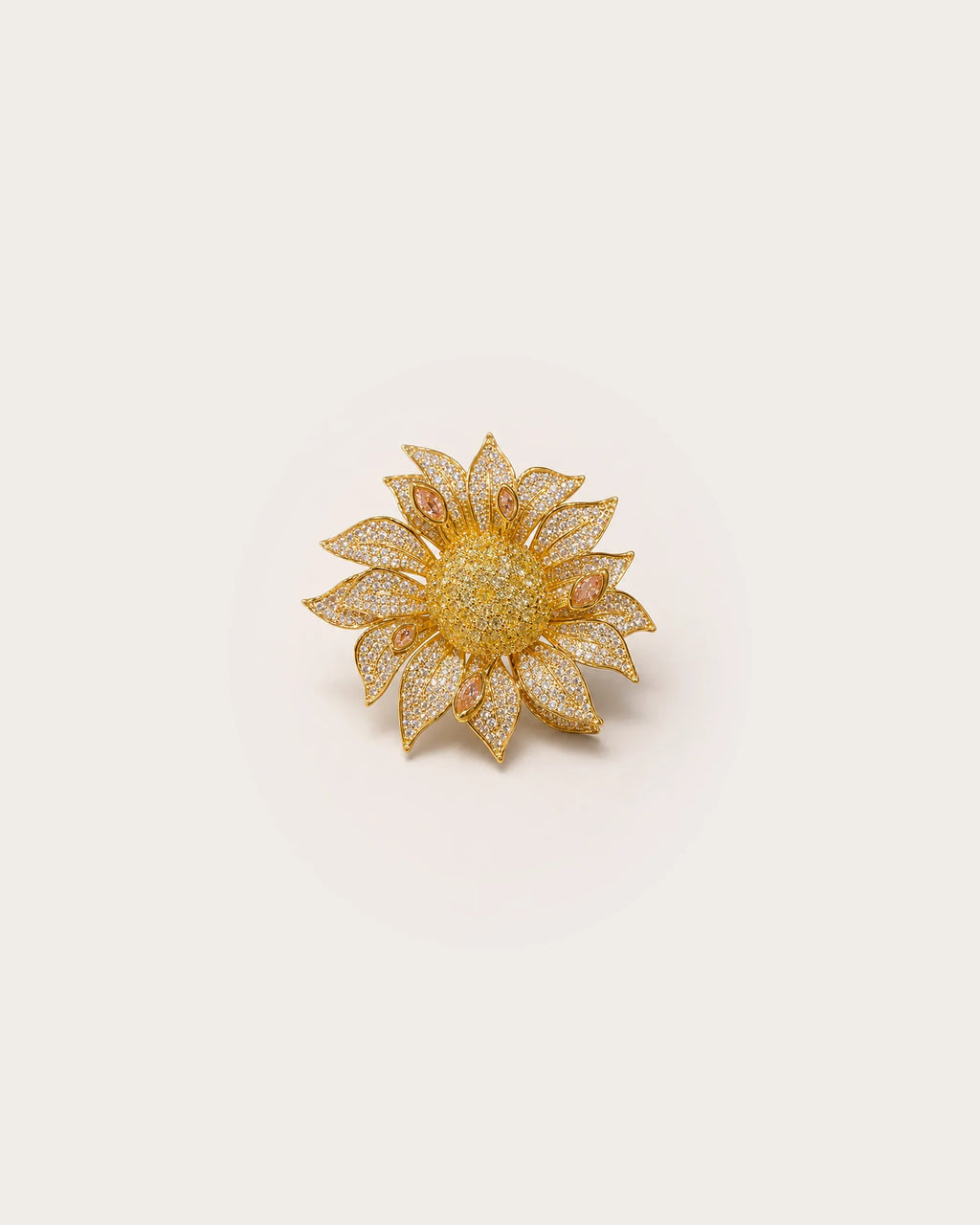 Solvi Layered Crystal Sunflower Brooch on a warm #F0EBE9 studio background with a natural contact shadow