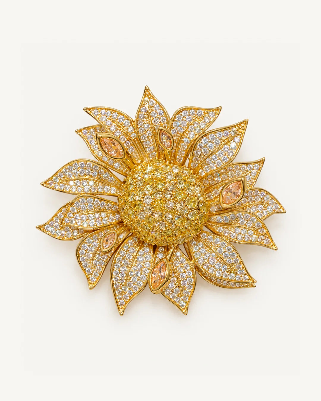 Solvi Layered Crystal Sunflower Brooch on a warm #F0EBE9 studio background with a natural contact shadow