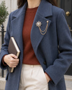 Stella Starburst Lapel Chain Brooch in gold-tone finish — wider wearing view with neutral tailoring