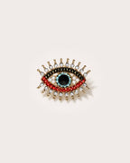 Suoja Multicolor Crystal Eye Brooch on a warm pale studio background with a natural contact shadow