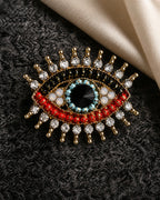 Macro view of the Suoja brooch with clear crystal accents and multicolour beadwork