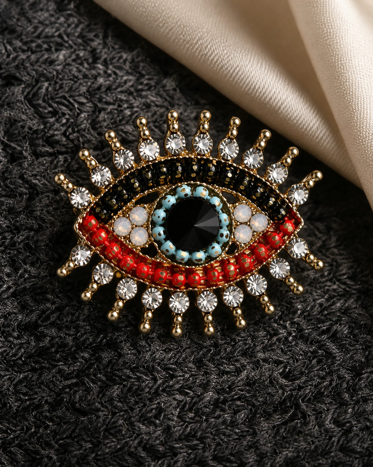 Macro view of the Suoja brooch with clear crystal accents and multicolour beadwork