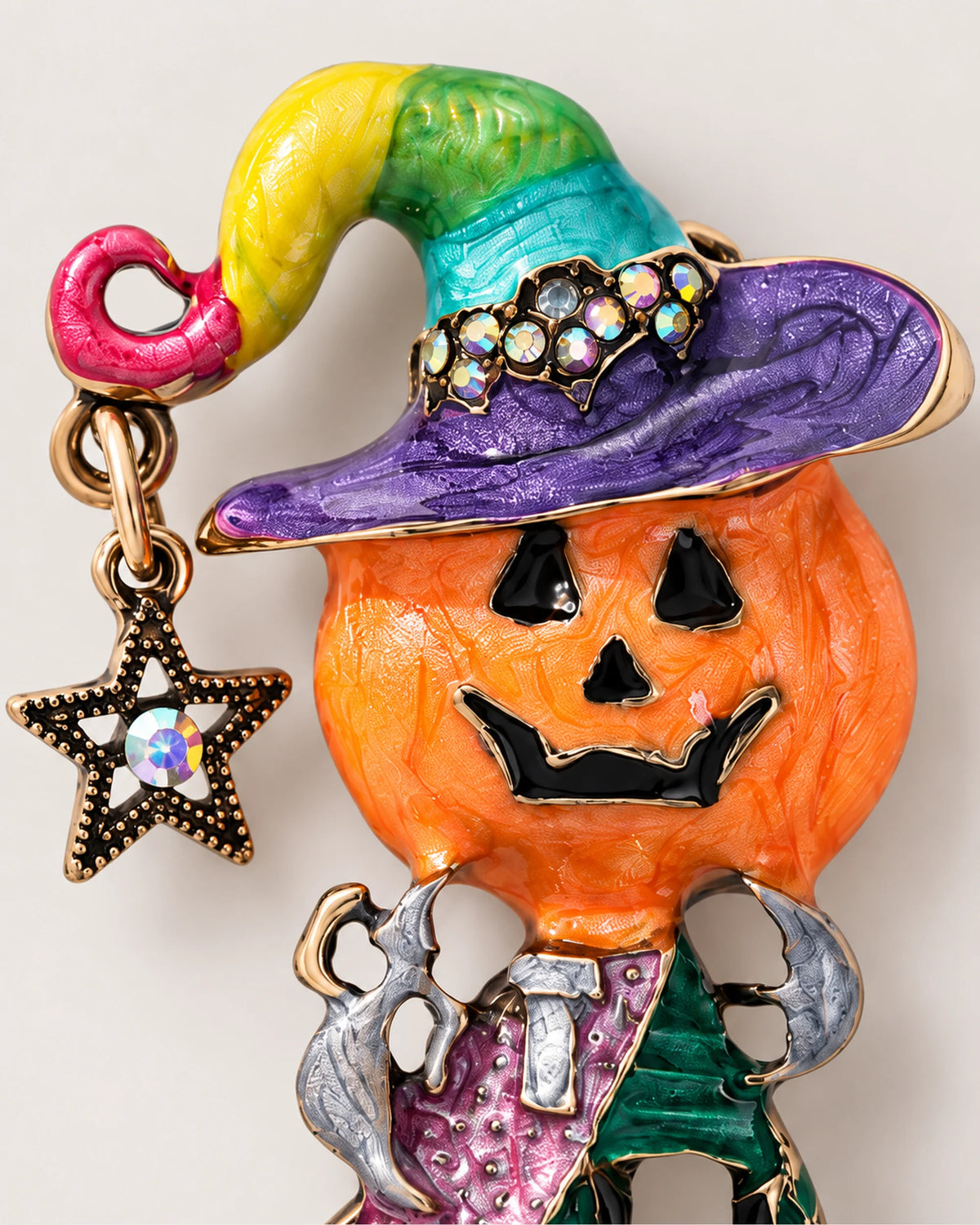 A multicolored curled hat, purple brim and star accent sit above the pumpkin face.