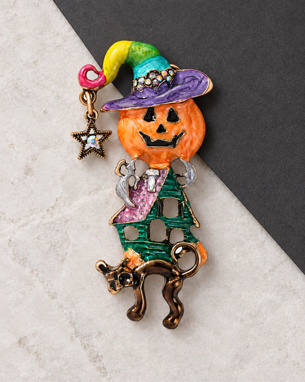 Taika Pumpkin Witch Brooch in a product still life