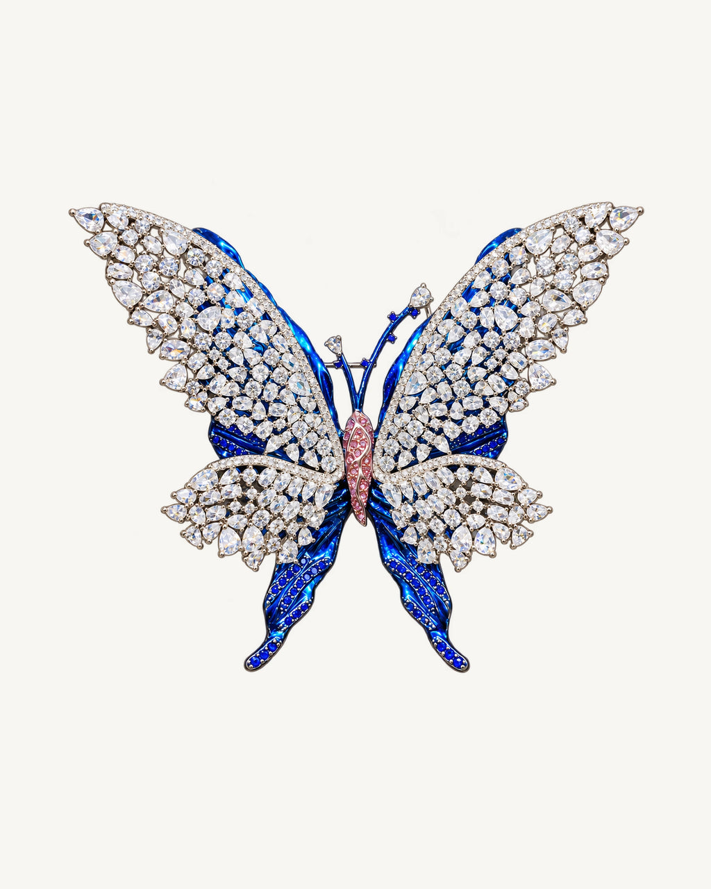 Front view of Tilda Openwork Blue Butterfly Brooch with clear stone lattice wings over blue sculpted layers and a pink centre.