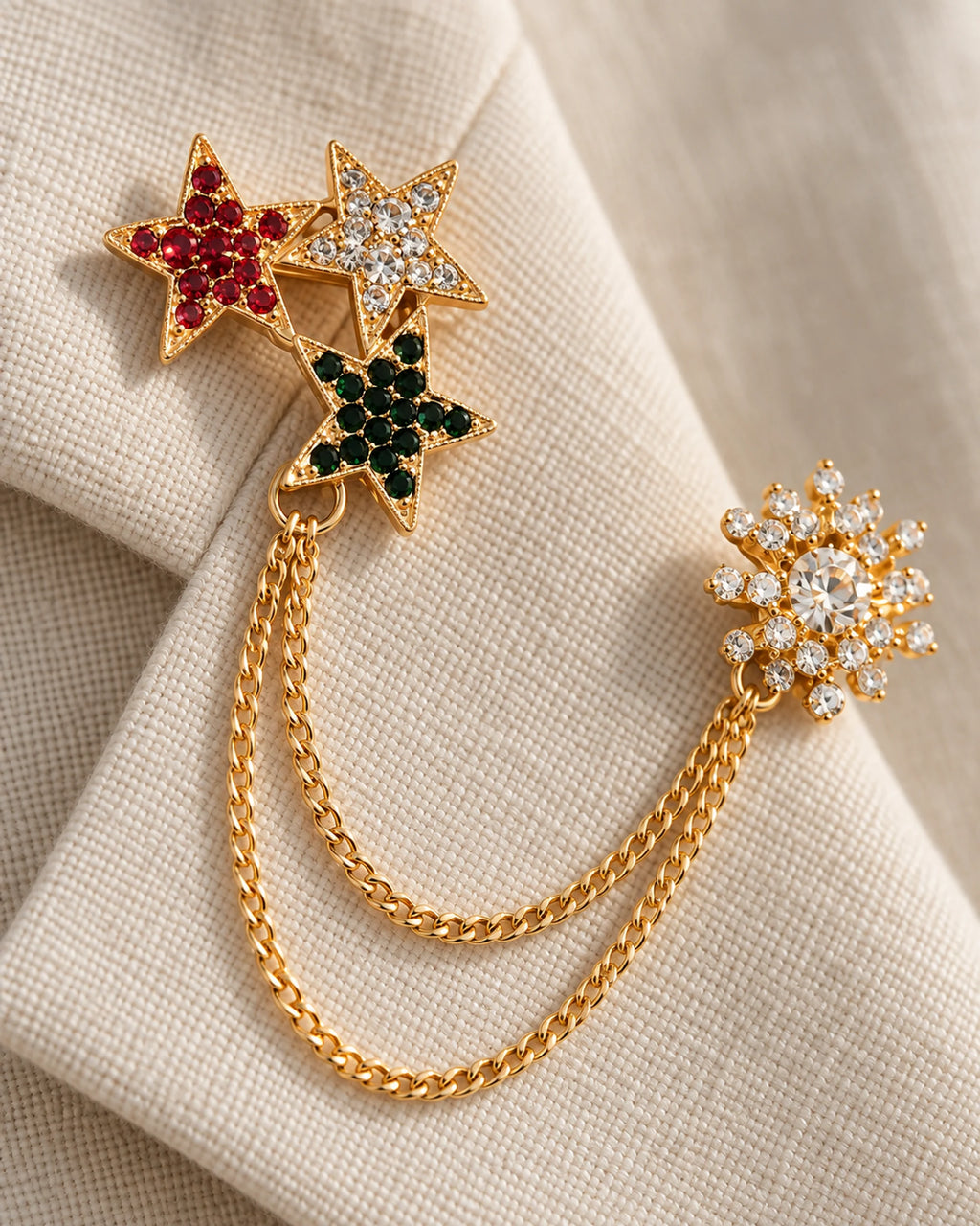 Tria Tricolor Star Lapel Chain Brooch in gold-tone finish; motif and chain detail