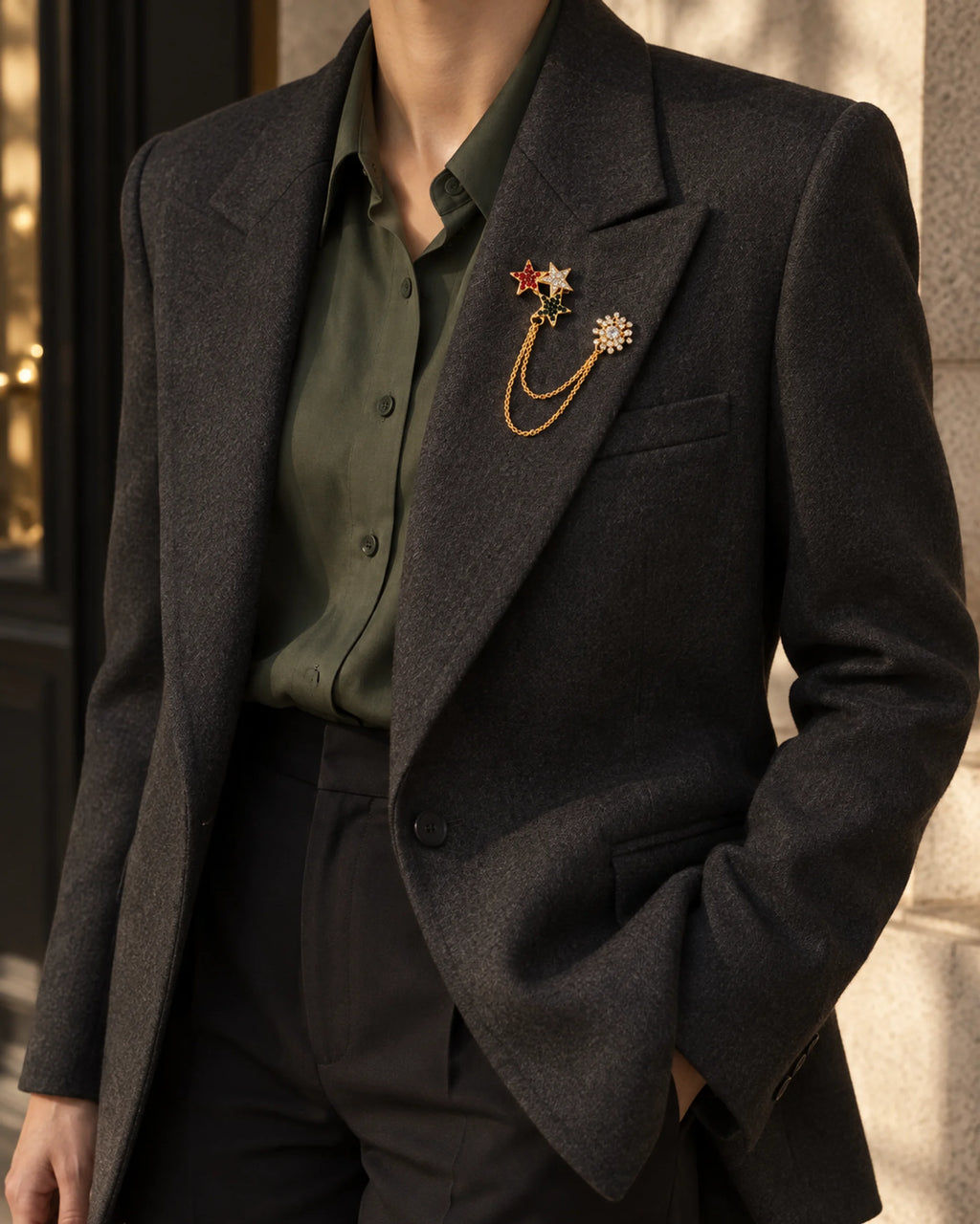 Tria Tricolor Star Lapel Chain Brooch in gold-tone finish; wider faceless jacket styling