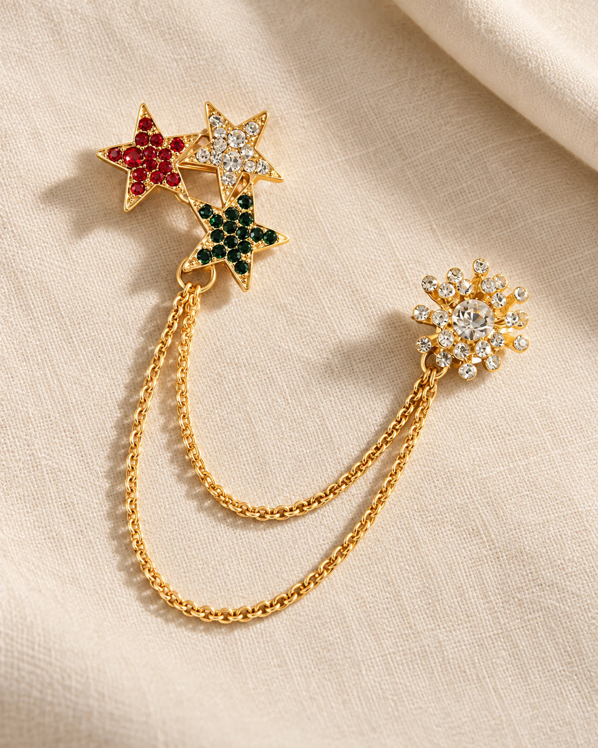 Tria Tricolor Star Lapel Chain Brooch in gold-tone finish; complete still-life drape