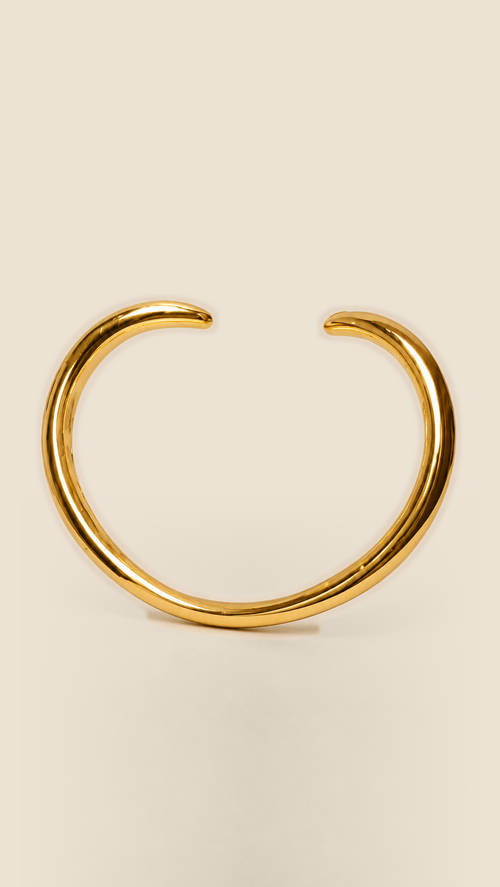 Aalto Heart Cuff Bracelet with an open heart-inspired shape and warm gold-tone finish